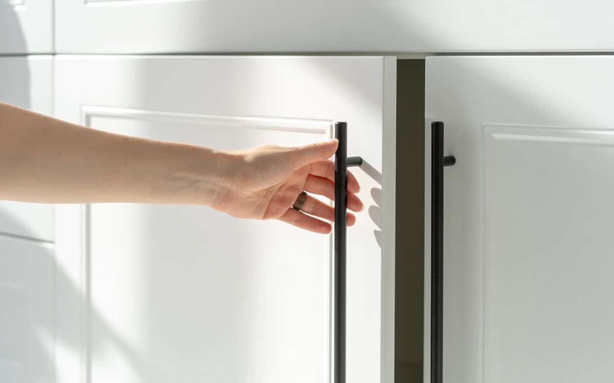 white cabinet door being opened